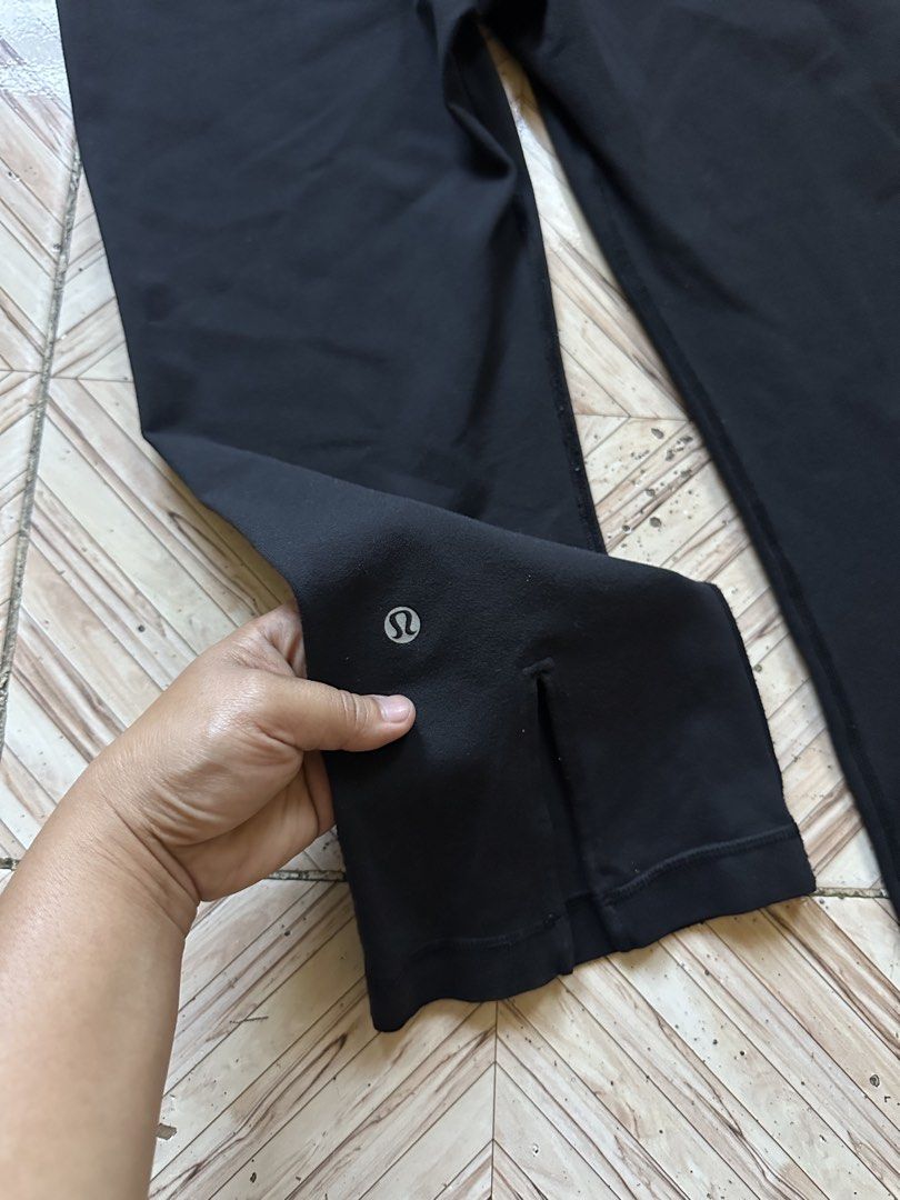 Lululemon Black Crop Leggings Size 8 (Category: Activewear) located in Angeles City. Submitted by alejeong27 (Listing ID 1468335840, Image 3). Description: - Brand: Lululemon - Color: Black - Size: 8 (tag inside waistband) - Features: Foldover waistband with black/white stripes, small slit at back cuffs, and reflective logo near hem - Condition: Pre-loved with a small hole on the right leg (kindly check the photos closely before buying).