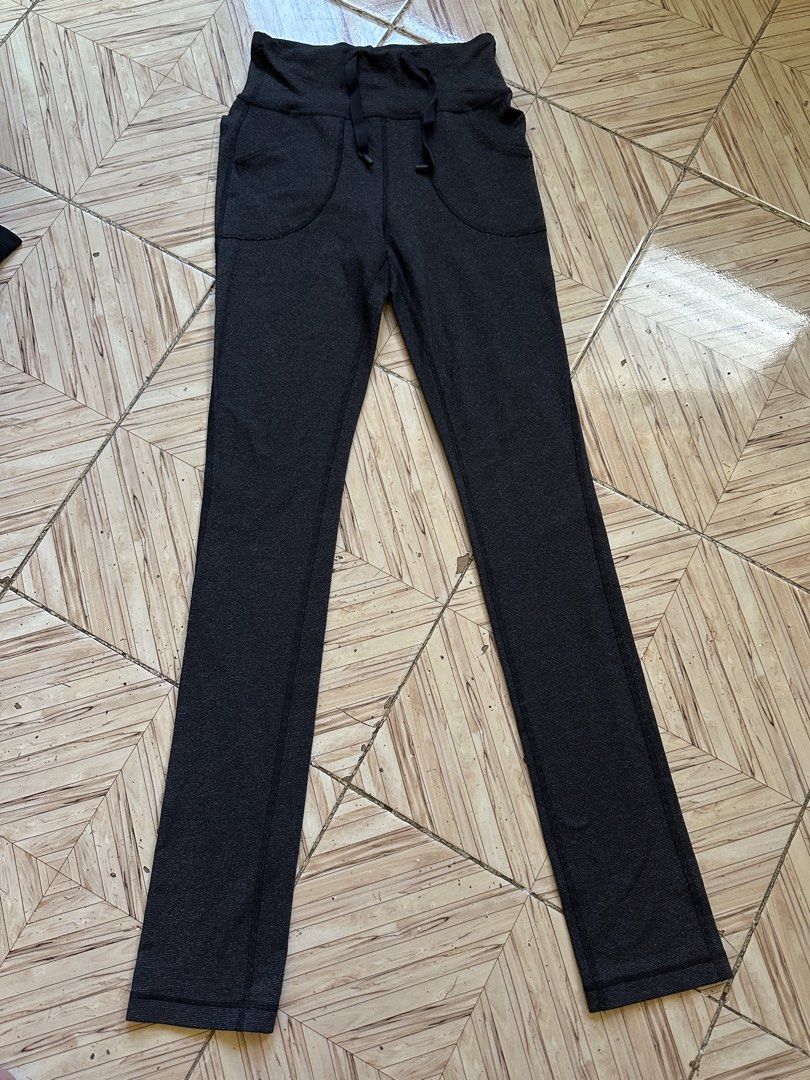 Lululemon Black Ribbed Drawstring Athletic Pants size 4 (Category: Joggers) located in Angeles City. Submitted by alejeong27 (Listing ID 1468337110, Image 1). Description: - Brand: Lululemon - Color: Dark charcoal black - Size: 4 (verified by size dot in pocket) - Material: Ribbed textured fabric - Features: Adjustable drawstring waistband, two front pockets, straight leg cut - Details: Classic silver omega logo near the lower leg cuff - Conditio