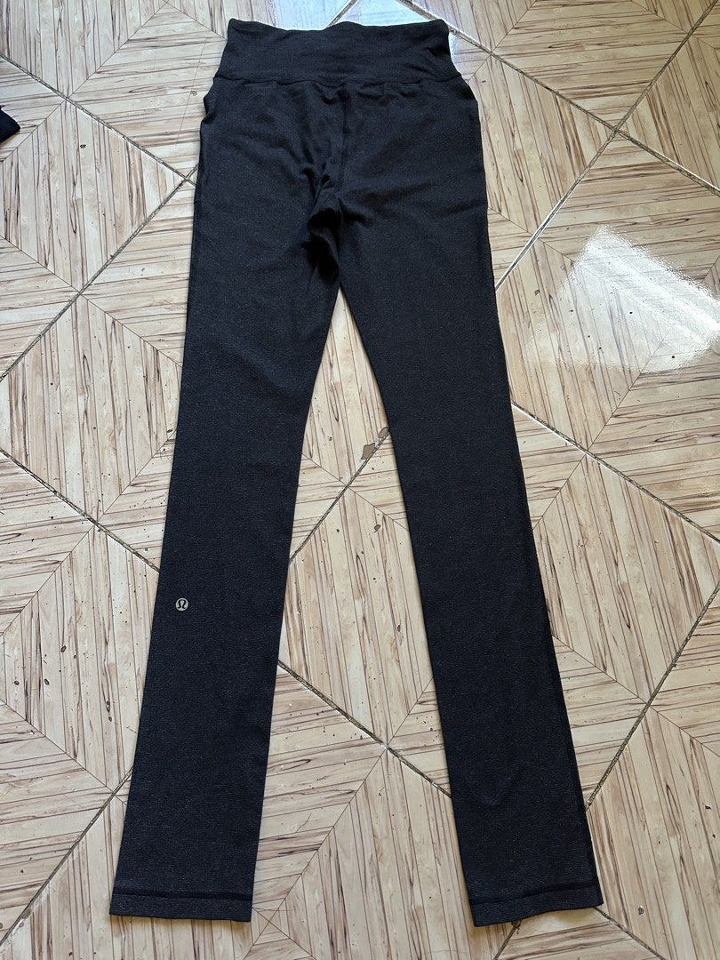 Lululemon Black Ribbed Drawstring Athletic Pants size 4 (Category: Joggers) located in Angeles City. Submitted by alejeong27 (Listing ID 1468337110, Image 2). Description: - Brand: Lululemon - Color: Dark charcoal black - Size: 4 (verified by size dot in pocket) - Material: Ribbed textured fabric - Features: Adjustable drawstring waistband, two front pockets, straight leg cut - Details: Classic silver omega logo near the lower leg cuff - Conditio