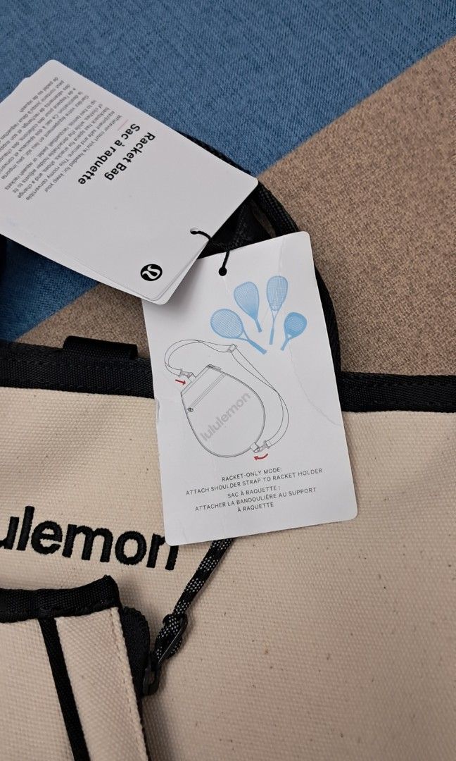 Lululemon Canvas Racquet Backpack Bag Off White (Category: Backpacks) located in Manila. Submitted by myrabundoc63934 (Listing ID 1468372188, Image 3). Description: - Brand new with original store tags attached - Authentic Lululemon off-white heavy-duty cotton canvas backpack - Dedicated circular front pocket designed specifically for a racquet, featuring a hanging tag instruction graphic - Stylish black trim details with convenient top grab hand