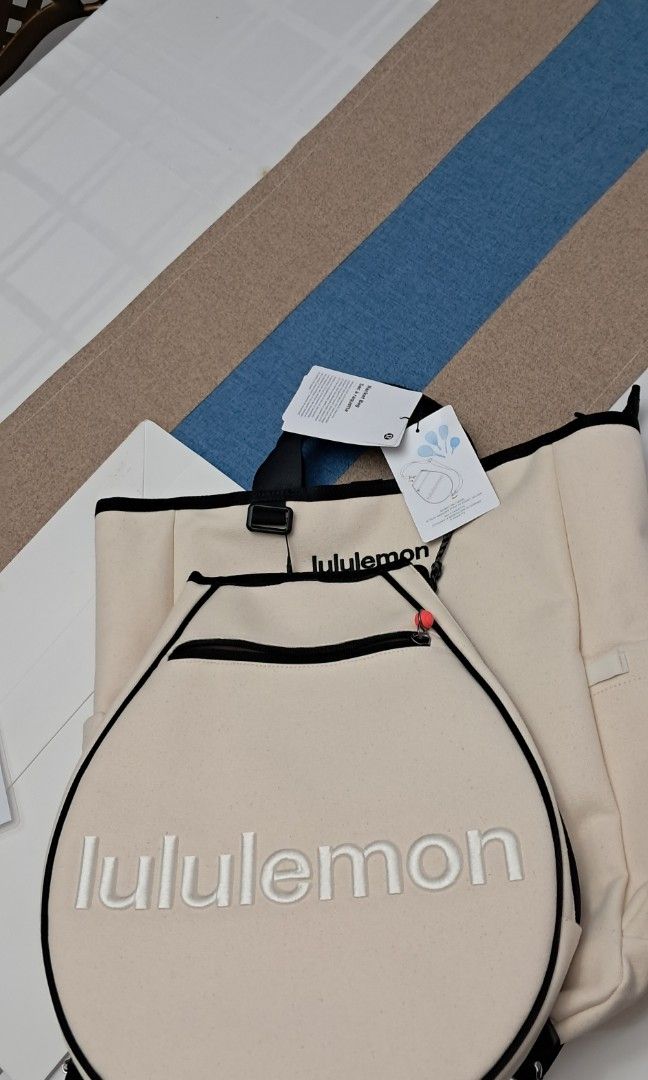 Lululemon Canvas Racquet Backpack Bag Off White (Category: Backpacks) located in Manila. Submitted by myrabundoc63934 (Listing ID 1468372188, Image 2). Description: - Brand new with original store tags attached - Authentic Lululemon off-white heavy-duty cotton canvas backpack - Dedicated circular front pocket designed specifically for a racquet, featuring a hanging tag instruction graphic - Stylish black trim details with convenient top grab hand