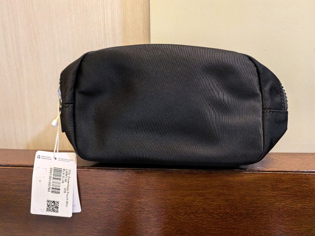 Lululemon City Essentials Pouch Mini Black (Category: Purses & Pouches) located in Manila. Submitted by maifabfinds (Listing ID 1468459978, Image 3). Description: - Brand new with original store tags attached - Color: Classic Black - Durable fabric material built to last - Secure zip closure to keep items safe - Convenient front slip pocket for quick access - Interior mesh compartment for organizing small essentials - Compact and versatile Lulule