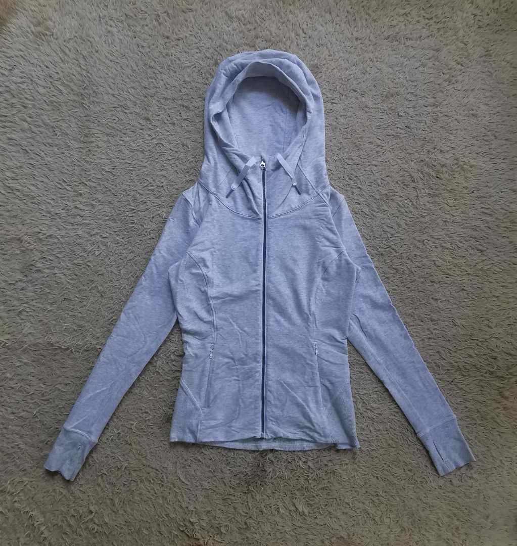 Lululemon Define Jacket Grey Size 6 (Category: Coats, Jackets and Outerwear) located in Davao. Submitted by dmp1993 (Listing ID 1468455379, Image 1). Description: Grey Lululemon zip-up jacket in size 6. Full front zipper, high neckline, and a hood with drawstrings. Long sleeves with thumbholes. Two zippered hand pockets on the front. Ribbed fabric panels along the sides and back hem. Interior white lining..