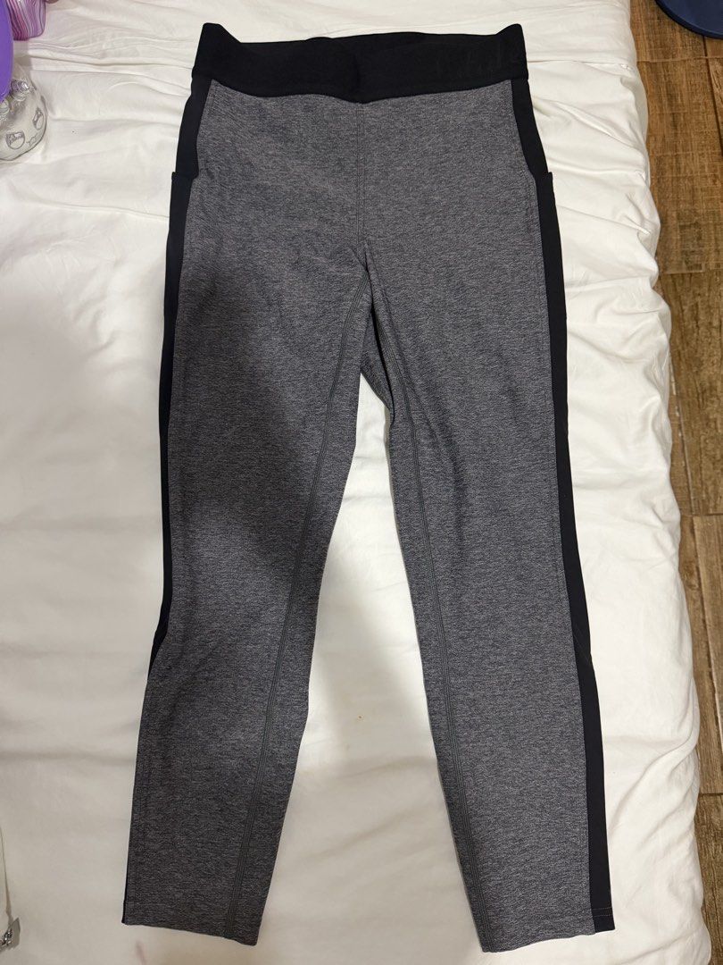 Lululemon Grey and Black Athletic Leggings (Category: Activewear) located in Manila. Submitted by bellafleur (Listing ID 1468397596, Image 1). Description: - Authentic Lululemon athletic leggings in heather grey and solid black - Wide, supportive waistband for maximum comfort - Trendy contrasting black side panels with curved lower leg detailing - Signature Lululemon logo stamped on the back left calf - High-stretch fabric ideal for workouts, yog