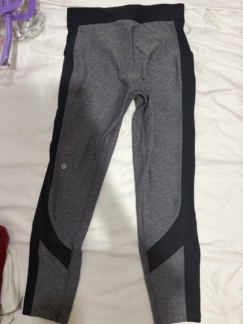 Lululemon Grey and Black Athletic Leggings (Category: Activewear) located in Manila. Submitted by bellafleur (Listing ID 1468397596, Image 2). Description: - Authentic Lululemon athletic leggings in heather grey and solid black - Wide, supportive waistband for maximum comfort - Trendy contrasting black side panels with curved lower leg detailing - Signature Lululemon logo stamped on the back left calf - High-stretch fabric ideal for workouts, yog