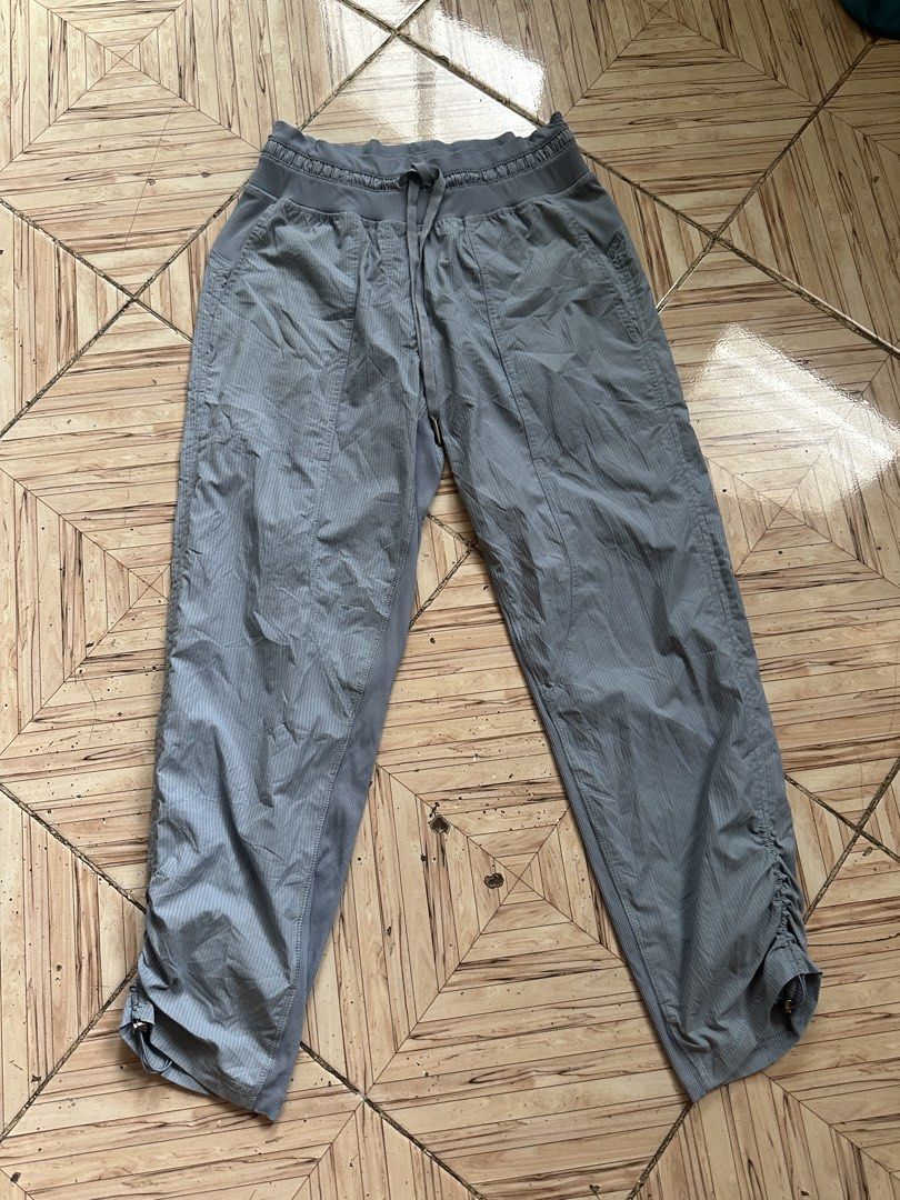 Lululemon Grey Joggers Pants Size 4 (Category: Joggers) located in Angeles City. Submitted by alejeong27 (Listing ID 1468329293, Image 1). Description: - Brand: Lululemon - Size: 4 - Color: Grey - Fabric: Chevron stripe textured fabric - Waistband: Drawstring with ribbed knit trim - Pockets: Convenient front hand pockets - Details: Ribbed side panels for extra stretch and comfort - Hems: Adjustable cinched hems with toggles for a custom fit.