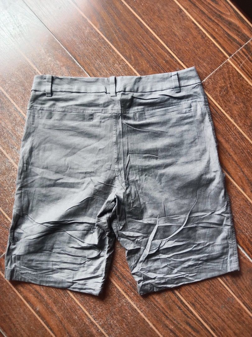 Lululemon Grey Shorts Size 32 (Category: Shorts) located in Manila. Submitted by nadyrl (Listing ID 1468423862, Image 2). Description: - Brand/Model: Lululemon shorts - Color: Grey - Size: 32 (Waist flat-lay: approx. 17.5") - Closure: Front button with belt loops - Pockets: Stylish back welt pockets - Details: Subtle logo near bottom hem - Condition/Vibe: Great staple piece for casual days.