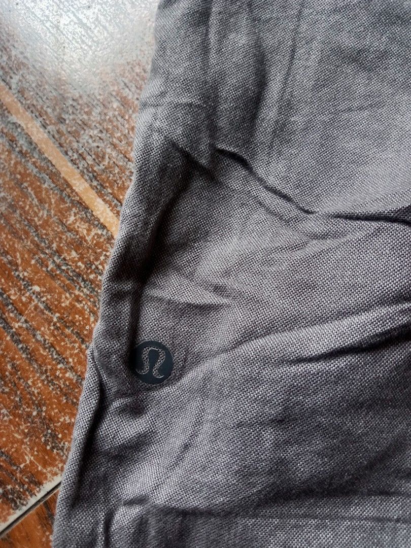 Lululemon Grey Shorts Size 32 (Category: Shorts) located in Manila. Submitted by nadyrl (Listing ID 1468423862, Image 3). Description: - Brand/Model: Lululemon shorts - Color: Grey - Size: 32 (Waist flat-lay: approx. 17.5") - Closure: Front button with belt loops - Pockets: Stylish back welt pockets - Details: Subtle logo near bottom hem - Condition/Vibe: Great staple piece for casual days.