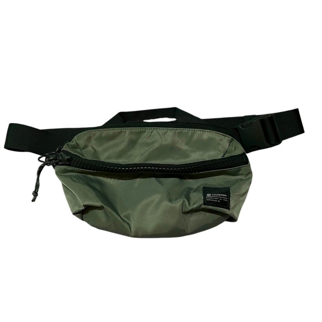 Lululemon Olive Green Belt Bag (Category: Belt bags, Clutches and Pouches) located in Cagayan de Oro. Submitted by lootfindzzzz (Listing ID 1468354892, Image 1). Description: - Authentic Lululemon belt bag in a stylish olive green color - Durable and adjustable black strap with secure plastic buckle closure - Spacious main compartment featuring a large chunky zipper with dual pulls and pull cords - Convenient top grab handle for easy carrying - I