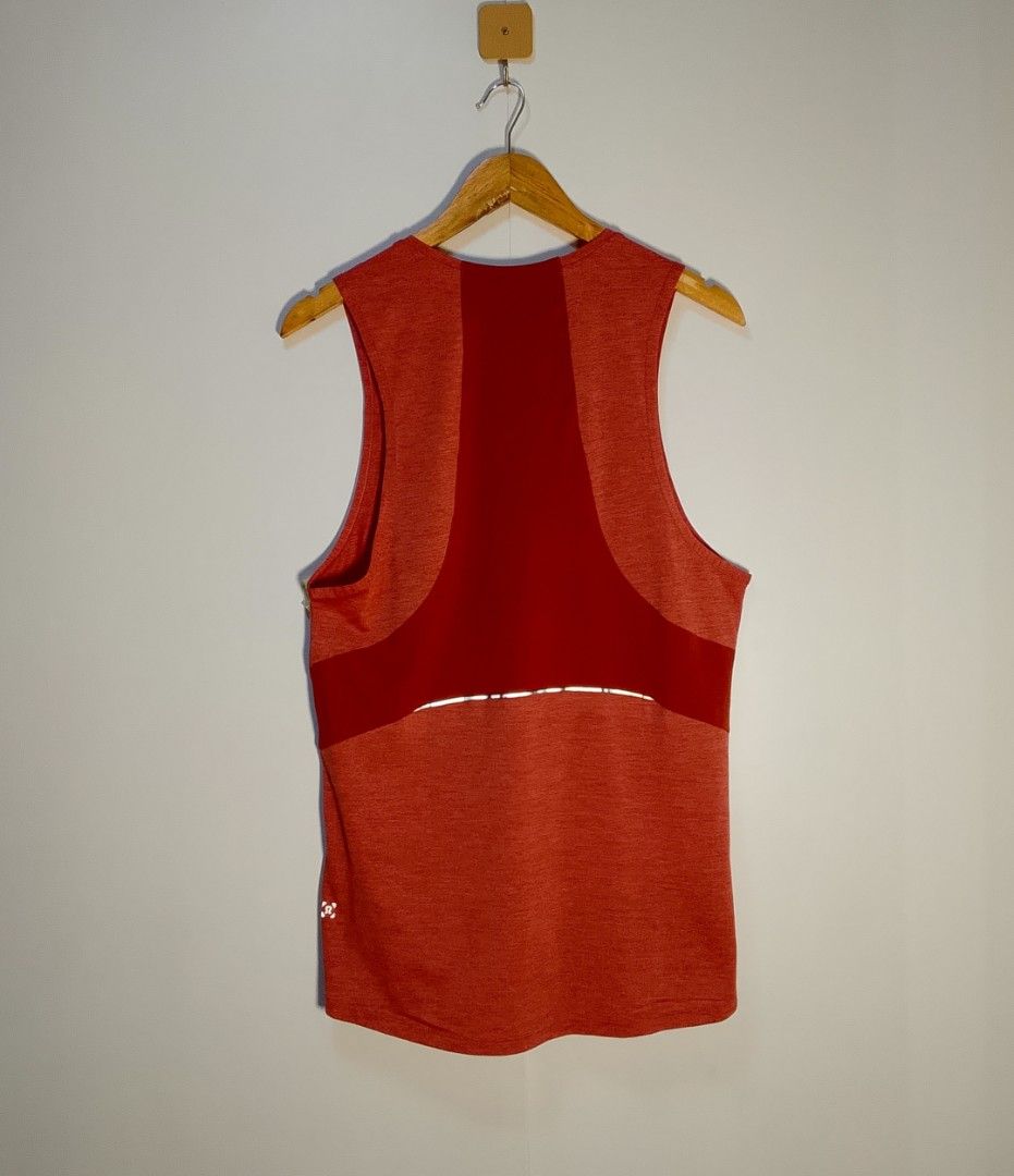Lululemon Red Running Tank Top (Category: Activewear) located in Manila. Submitted by moisky18 (Listing ID 1468456550, Image 2). Description: - Brand: Lululemon - Color: Heathered red with contrast solid red panels - Style: Crew neck, sleeveless workout tank top - Features: Reflective strips near the hem for evening visibility, iconic omega logo on lower left hip - Fabric: Lightweight, breathable, and sweat-wicking - Condition: Excellent pre-love