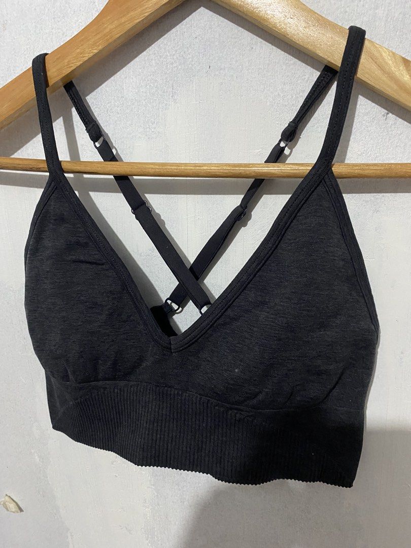 Lululemon Sports Bra (Category: Activewear) located in Bulacan. Submitted by _myarchive (Listing ID 1468406794, Image 3). Description: - Brand: Lululemon -xs-s - Style: V-neck with stylish cross-back adjustable straps - Band: Ribbed underband for a secure and comfortable fit - Material: Seamless, ultra-stretchy fabric - Details: Subtle Lululemon logo on the back - Condition: Excellent, perfect for workouts or everyday lounging.
