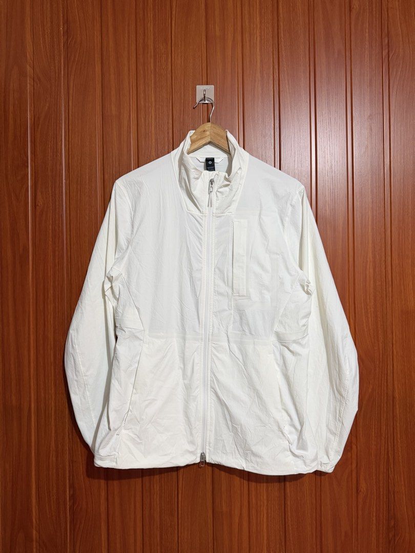 Lululemon White Lightweight Full Zip Jacket Size S (Category: Coats, Jackets and Outerwear) located in Manila. Submitted by tlfph (Listing ID 1468295050, Image 1). Description: - Brand: Lululemon - Style: Full zip jacket with high neck collar and chest pocket - Color: White - Size: S - Material: Lightweight nylon and elastane blend - Features: Long sleeves with elastic cuffs, iconic Lululemon logo on the back hem - Condition: Clean and ready to w