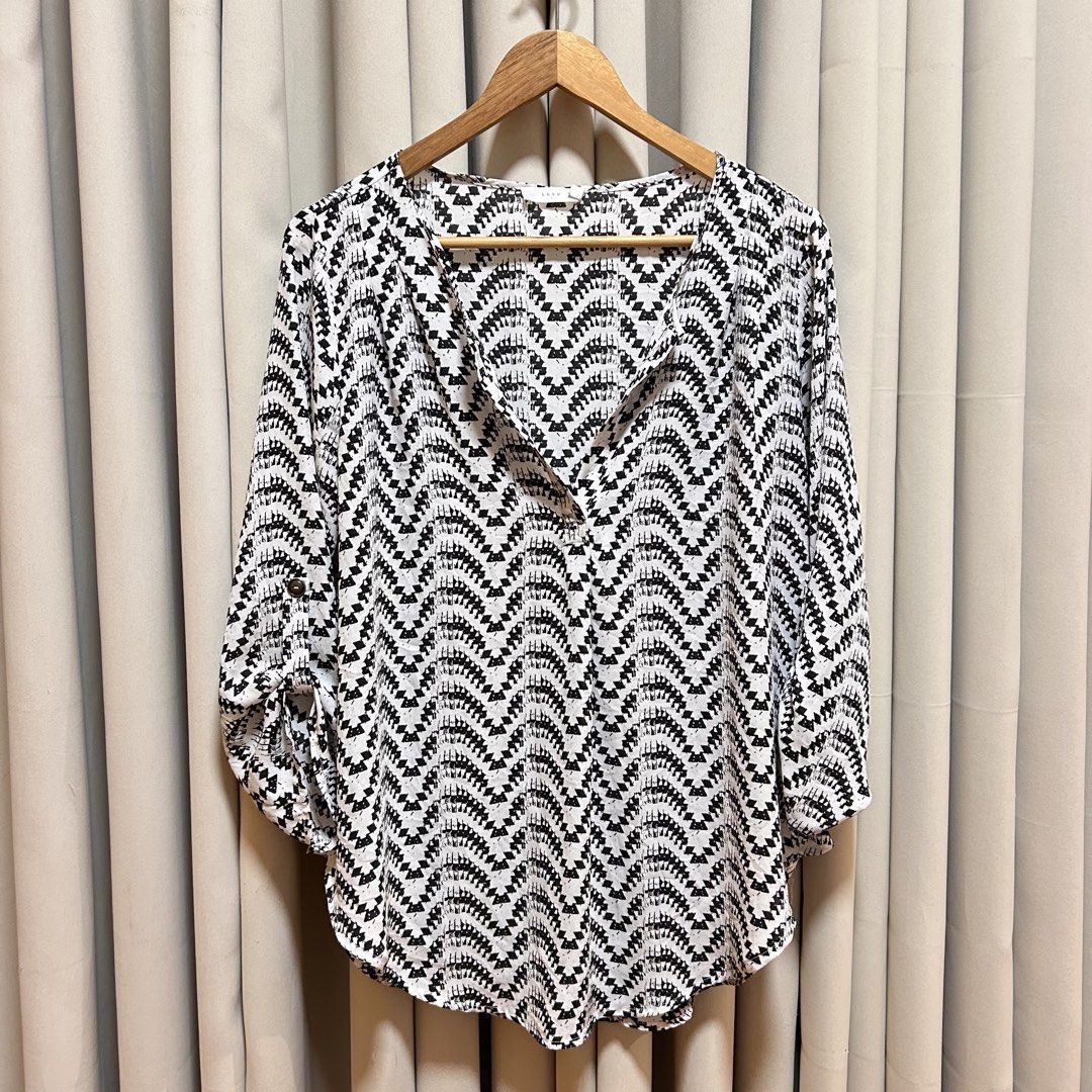 L-XL Lush Black & White Aztec Print Blouse (Category: Blouses) located in Rizal. Submitted by from99abovecloset (Listing ID 1468376399, Image 1). Description: CODE:010 Size: L-XL Armhole (laid flat):10” Bust (around): 48” Length (laid flat): 32” Soft poly | loose | like new .
