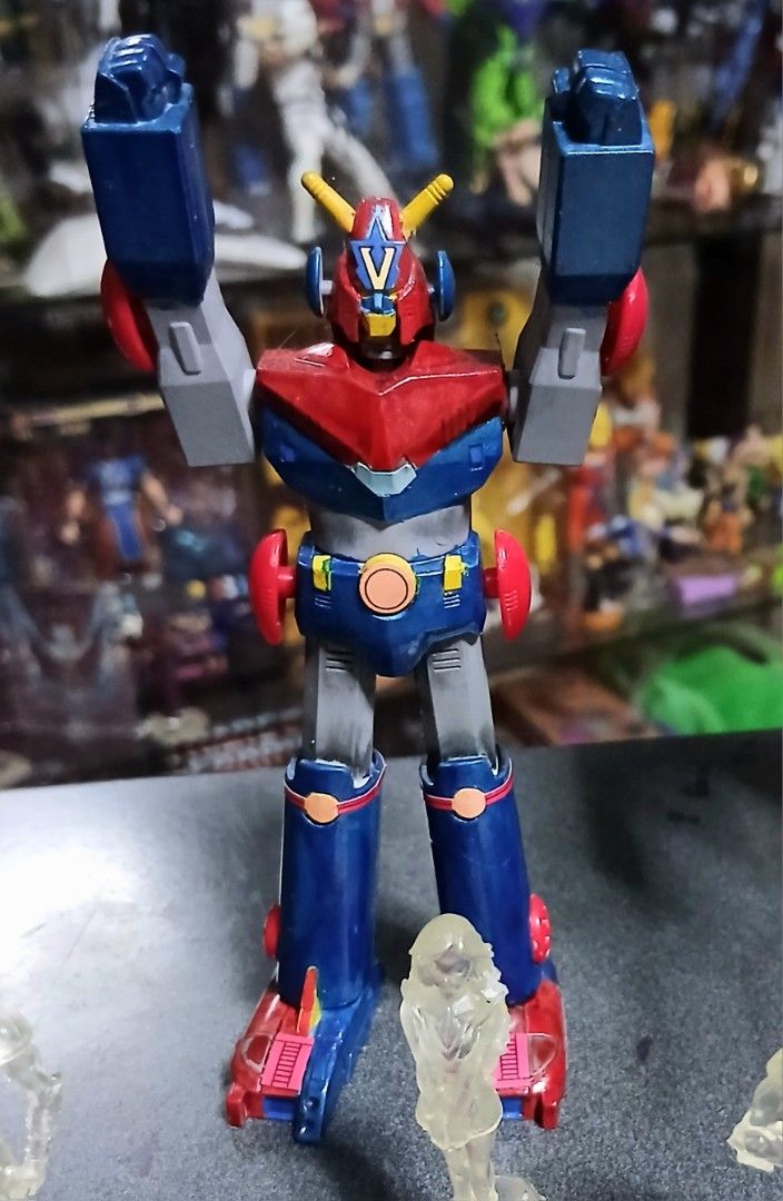 Macross VF-1S and vintage anime robot model bundle (Category: Gundam & Model Kits) located in Quezon City. Submitted by mrs.maria (Listing ID 1468471415, Image 2). Description: - Complete retro mecha and anime figure lot - Includes large Macross VF-1S Valkyrie model with gun, red and blue robot, gold mechanical figure, and green spaceship on a stand - Comes with 4 clear resin character statues and manual booklet -Open po for trade G.I Joe Classif
