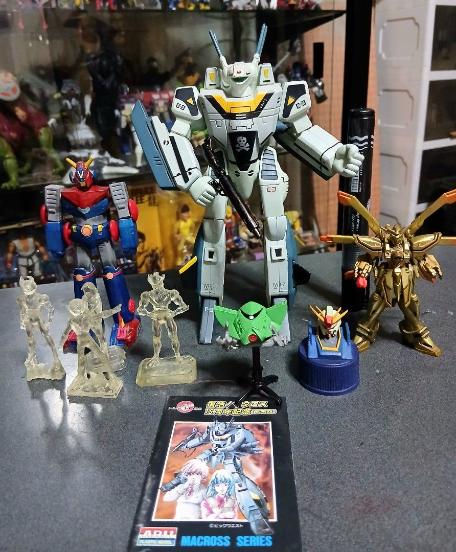 Macross VF-1S and vintage anime robot model bundle (Category: Gundam & Model Kits) located in Quezon City. Submitted by mrs.maria (Listing ID 1468471415, Image 3). Description: - Complete retro mecha and anime figure lot - Includes large Macross VF-1S Valkyrie model with gun, red and blue robot, gold mechanical figure, and green spaceship on a stand - Comes with 4 clear resin character statues and manual booklet -Open po for trade G.I Joe Classif