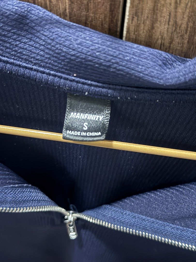 Manfinity Dark Blue Quarter Zip Polo Shirt (Category: Tshirts & Polo Shirts ) located in Las Pinas. Submitted by juls_mp (Listing ID 1468402843, Image 2). Description: - Brand/Style: Manfinity dark blue polo shirt - Size: Small - Material: Textured ribbed fabric - Features: Short sleeves, classic collar, and silver front zipper placket - Condition: Excellent / Clean look - Versatility: Easy to style for casual outings or smart-casual layering.