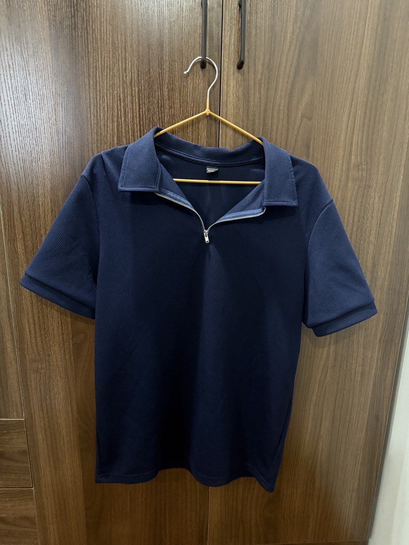 Manfinity Dark Blue Quarter Zip Polo Shirt (Category: Tshirts & Polo Shirts ) located in Las Pinas. Submitted by juls_mp (Listing ID 1468402843, Image 1). Description: - Brand/Style: Manfinity dark blue polo shirt - Size: Small - Material: Textured ribbed fabric - Features: Short sleeves, classic collar, and silver front zipper placket - Condition: Excellent / Clean look - Versatility: Easy to style for casual outings or smart-casual layering.