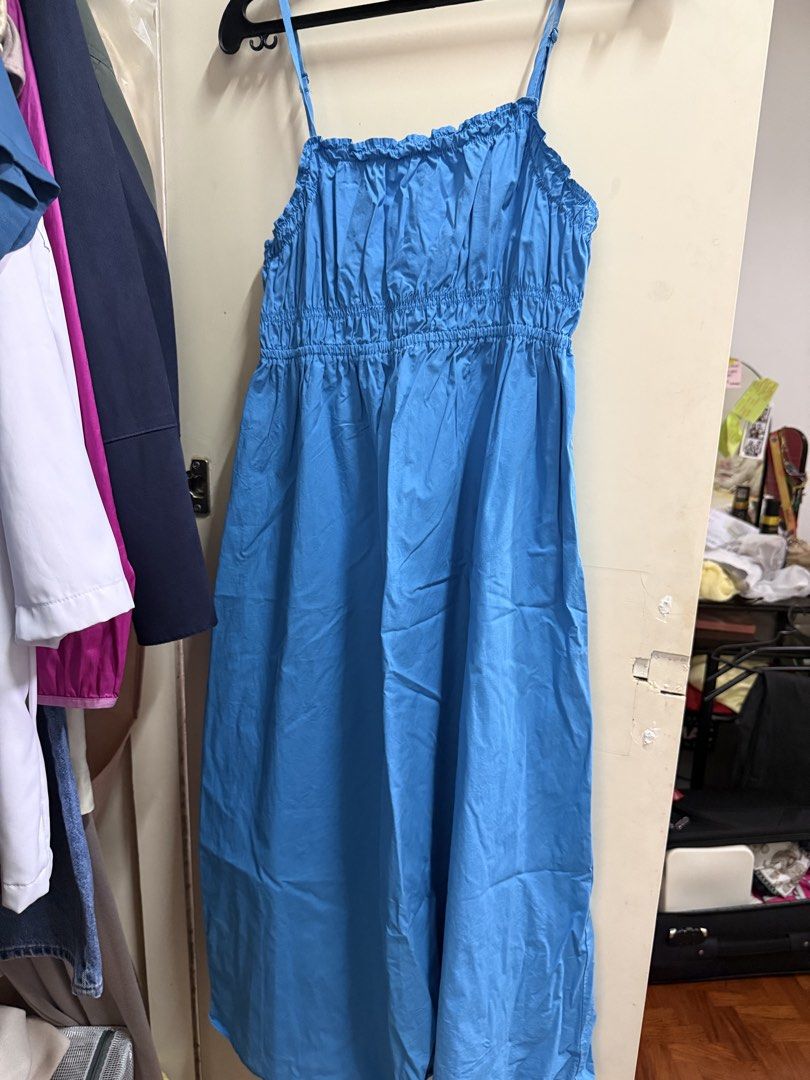Mango Bright Blue Smocked Midi Dress Adjustable Straps (Category: Dresses) located in Quezon City. Submitted by mikaela_0 (Listing ID 1468357337, Image 2). Description: - Color: Bright blue - Style: Sleeveless with thin adjustable straps - Bodice: Comfortable, stretchy smocked design Size medium, fits small to medium - Neckline: Square neck with ruffle trim - Fabric: Lightweight and flowy skirt - Perfect for: Warm weather and sunny days Good cond