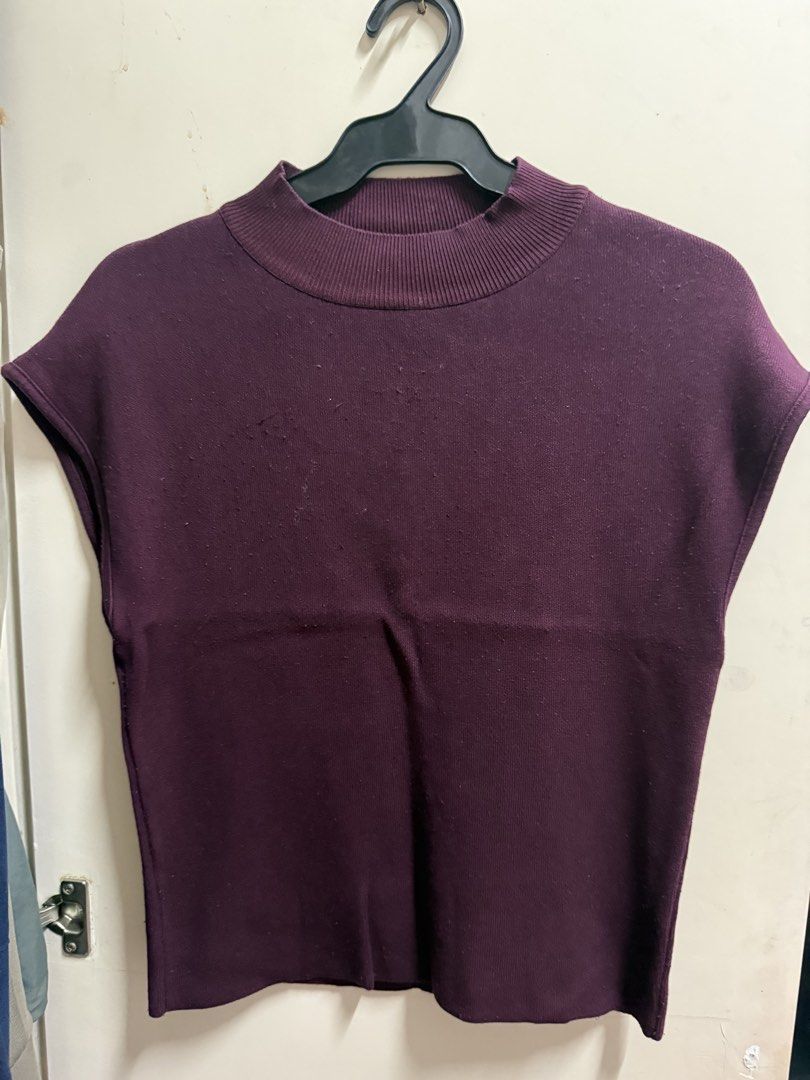 Mango Burgundy Knit Short Sleeve Top Medium (Category: Sleeveless) located in Quezon City. Submitted by mikaela_0 (Listing ID 1468354904, Image 2). Description: - Brand: Mango - Style: Sleeveless mock neck knit top - Color: Dark purple / Burgundy - Size: Medium - Origin: Made in Turkey - Fabric: Soft knit - Condition: Good/Worn with care - Features: Ribbed collar and hem, versatile basic for layering or everyday wear.