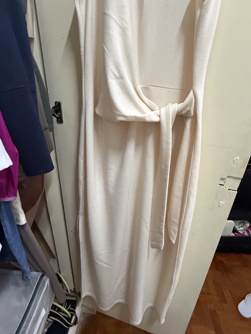 Mango Cream Sleeveless Side Tie Midi Dress Size Medium (Category: Dresses) located in Quezon City. Submitted by mikaela_0 (Listing ID 1468355334, Image 3). Description: - Brand: Mango - Style: Sleeveless cream midi dress with round neckline - Size: Medium, fits small to medium - Features: Includes matching waist tie belt for a customizable fit - Material: Smooth, comfortable knit fabric - Origin: Made in China - Condition: Clean, goodcondition .