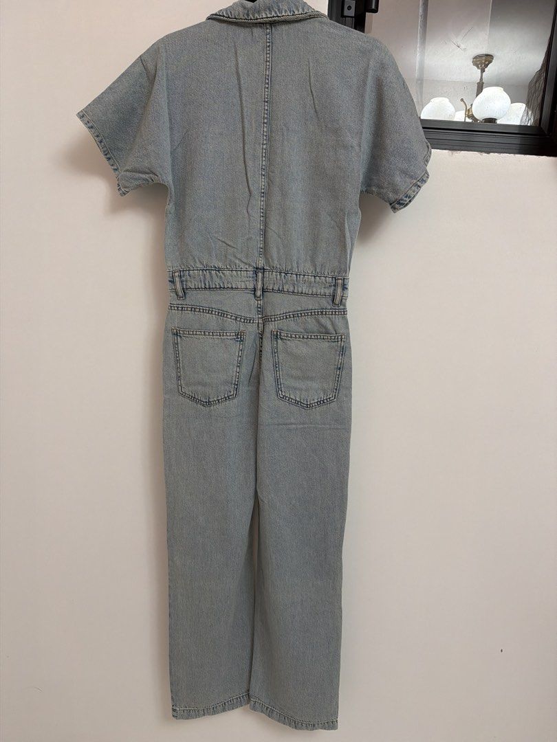 Mango Denim Jumpsuit Size XS (Category: Jumpsuits) located in Batangas. Submitted by luxuryinmyclowset (Listing ID 1468342548, Image 3). Description: - Brand: Mango - Style: Light wash denim jumpsuit / one-piece - Size: EUR-USA XS / MEX ECH - Features: Short sleeves, pointed collar, front button closure, and matching chest pockets - Fit: Fitted waist with belt loops and a straight leg cut - Pockets: Functional pockets on both front and back - Ori