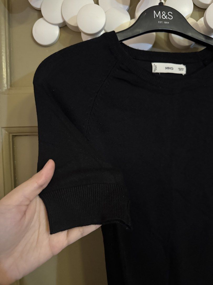 Mango Knit Top (Category: Blouses) located in Manila. Submitted by gabwie (Listing ID 1468411819, Image 3). Description: - Brand: Mango - Item: Short sleeve knit top - Color: Black - Size: S - Material/Origin: Lightweight fabric, made in Bangladesh - Design: Crew neck with ribbed cuffs and hem - Condition: Worn a few times, solid condition - Styling: Versatile piece, easy to match with jeans or skirts.