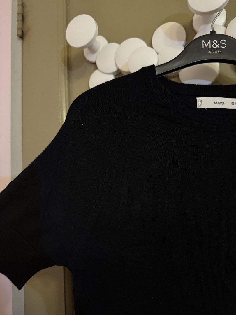 Mango Knit Top (Category: Blouses) located in Manila. Submitted by gabwie (Listing ID 1468411819, Image 2). Description: - Brand: Mango - Item: Short sleeve knit top - Color: Black - Size: S - Material/Origin: Lightweight fabric, made in Bangladesh - Design: Crew neck with ribbed cuffs and hem - Condition: Worn a few times, solid condition - Styling: Versatile piece, easy to match with jeans or skirts.