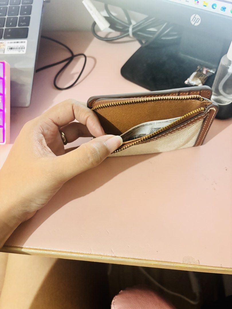 Mango MNG Canvas and Brown Leather Wallet (Category: Wallets & Card holders) located in Cavite. Submitted by gianflores (Listing ID 1468471522, Image 3). Description: - Brand: Mango - Material: Beige canvas with brown faux leather - Hardware: Gold-tone MNG logo - Compartments: Zip-around coin pocket on top + snap button closure with multiple card slots - Size: Compact, perfect for small bags - Condition: Brand new with tag still tucked inside the