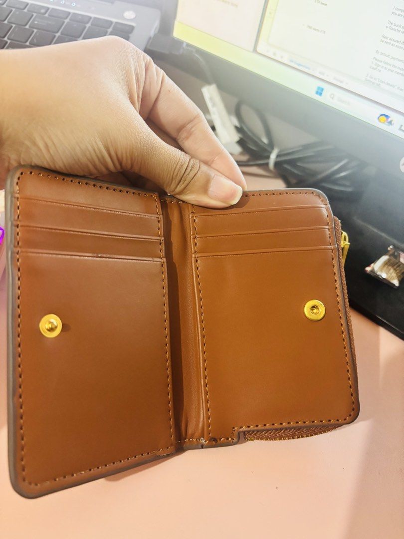 Mango MNG Canvas and Brown Leather Wallet (Category: Wallets & Card holders) located in Cavite. Submitted by gianflores (Listing ID 1468471522, Image 2). Description: - Brand: Mango - Material: Beige canvas with brown faux leather - Hardware: Gold-tone MNG logo - Compartments: Zip-around coin pocket on top + snap button closure with multiple card slots - Size: Compact, perfect for small bags - Condition: Brand new with tag still tucked inside the