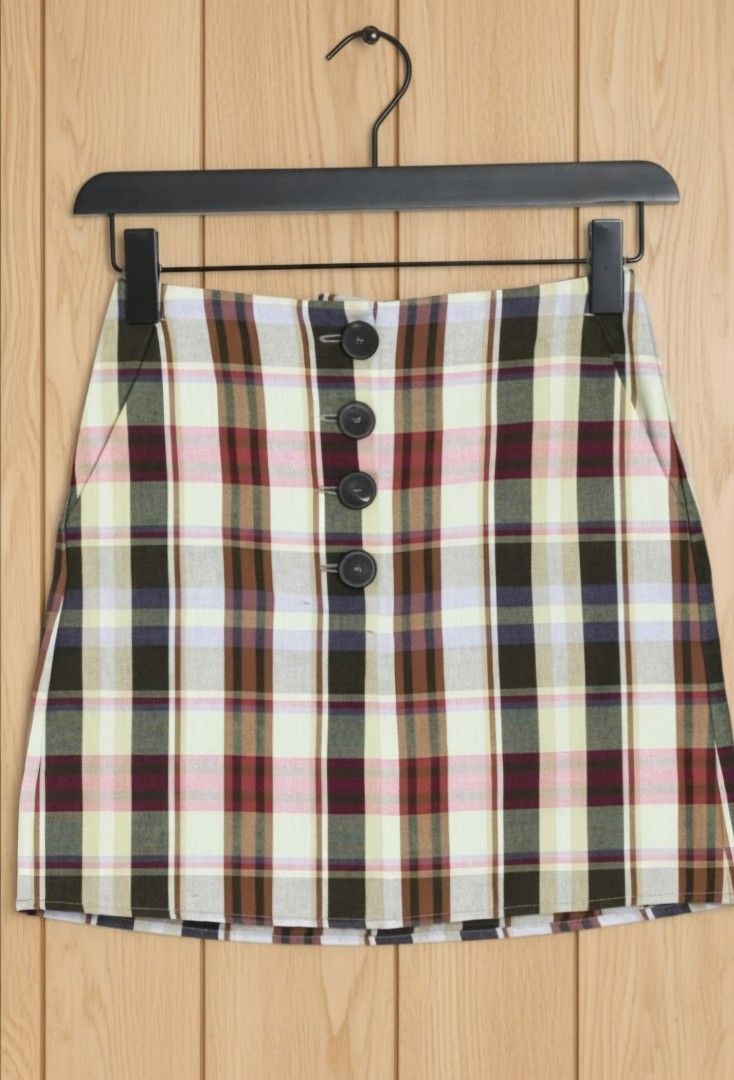 Mango MNG Plaid Mini Skirt (Category: Skirts) located in Quezon City. Submitted by curatedbymissgee (Listing ID 1468326704, Image 1). Description: - Brand: MNG - Style: Plaid mini skirt with button-front closure and front pockets - Pattern: Multicolor check (green, pink, brown, cream) - Details: Fully lined, clean inside and out - Size: EUR M / USA S / MEX M - Condition: Excellent, ready to wear - Great wardrobe staple for mixing and matching; gr