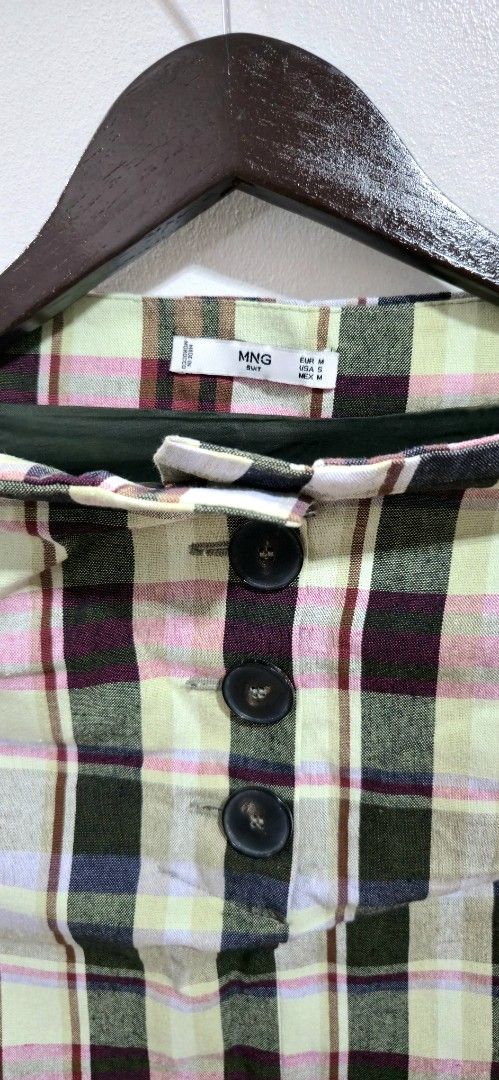 Mango MNG Plaid Mini Skirt (Category: Skirts) located in Quezon City. Submitted by curatedbymissgee (Listing ID 1468326704, Image 3). Description: - Brand: MNG - Style: Plaid mini skirt with button-front closure and front pockets - Pattern: Multicolor check (green, pink, brown, cream) - Details: Fully lined, clean inside and out - Size: EUR M / USA S / MEX M - Condition: Excellent, ready to wear - Great wardrobe staple for mixing and matching; gr