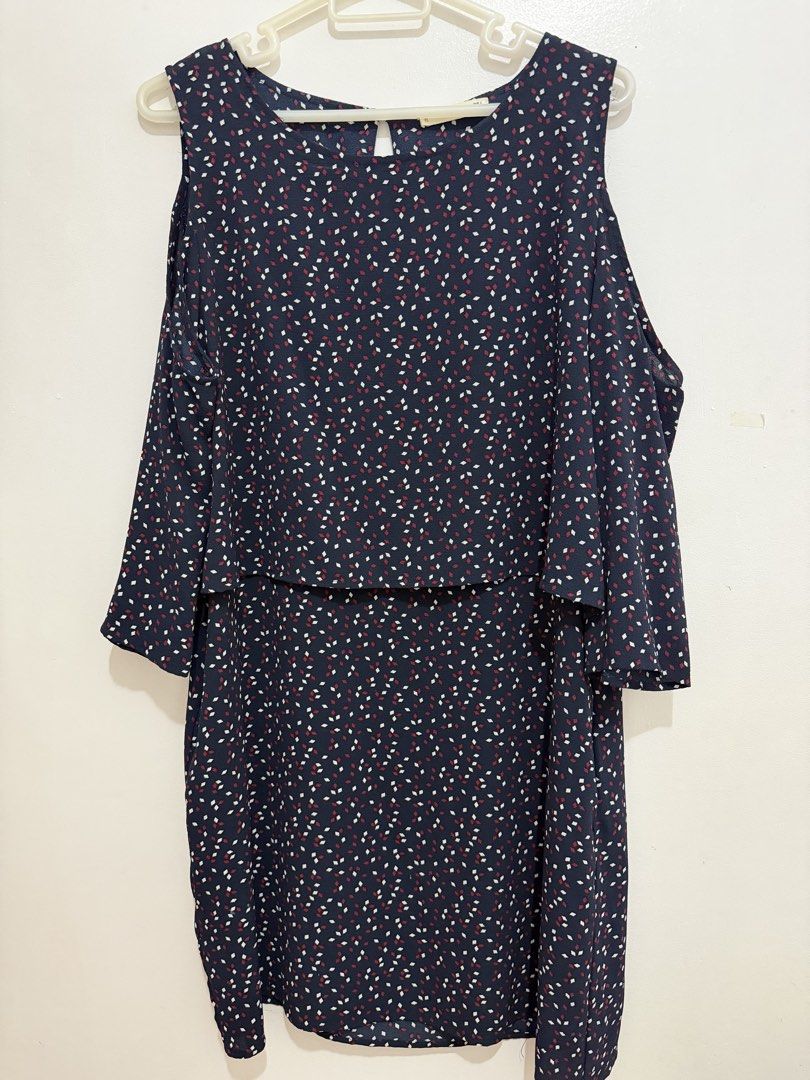 Mango Navy Blue Cold Shoulder Dress (Category: Dresses) located in Malolos. Submitted by eadiana (Listing ID 1468487511, Image 1). Description: - Brand: Mango - Color: Navy blue with tiny white and maroon diamond pattern - Style: Cold shoulder cutouts, draped short sleeves, and layered bodice overlay - Closure: Keyhole button closure at the back neckline - Size: EUR L, USA 8, MEX G - Fabric: Lightweight and comfortable, perfect for casual outings