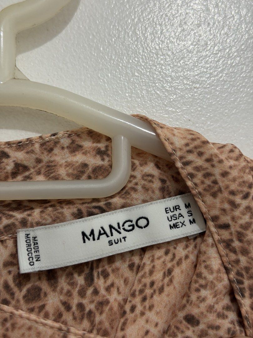 Mango Suit Animal Print Blouse (Category: Blouses) located in Malolos. Submitted by eadiana (Listing ID 1468487249, Image 2). Description: - Brand: Mango Suit - Pattern: Chic beige & brown animal print - Details: High neckline, keyhole back with button closure - Accents: Eye-catching gold sequin cuffs on long sleeves - Fabric: Lightweight, comfortable, and easy to style - Size: EUR M / USA S / MEX M (Made in Morocco) - Perfect for: Office wear, c