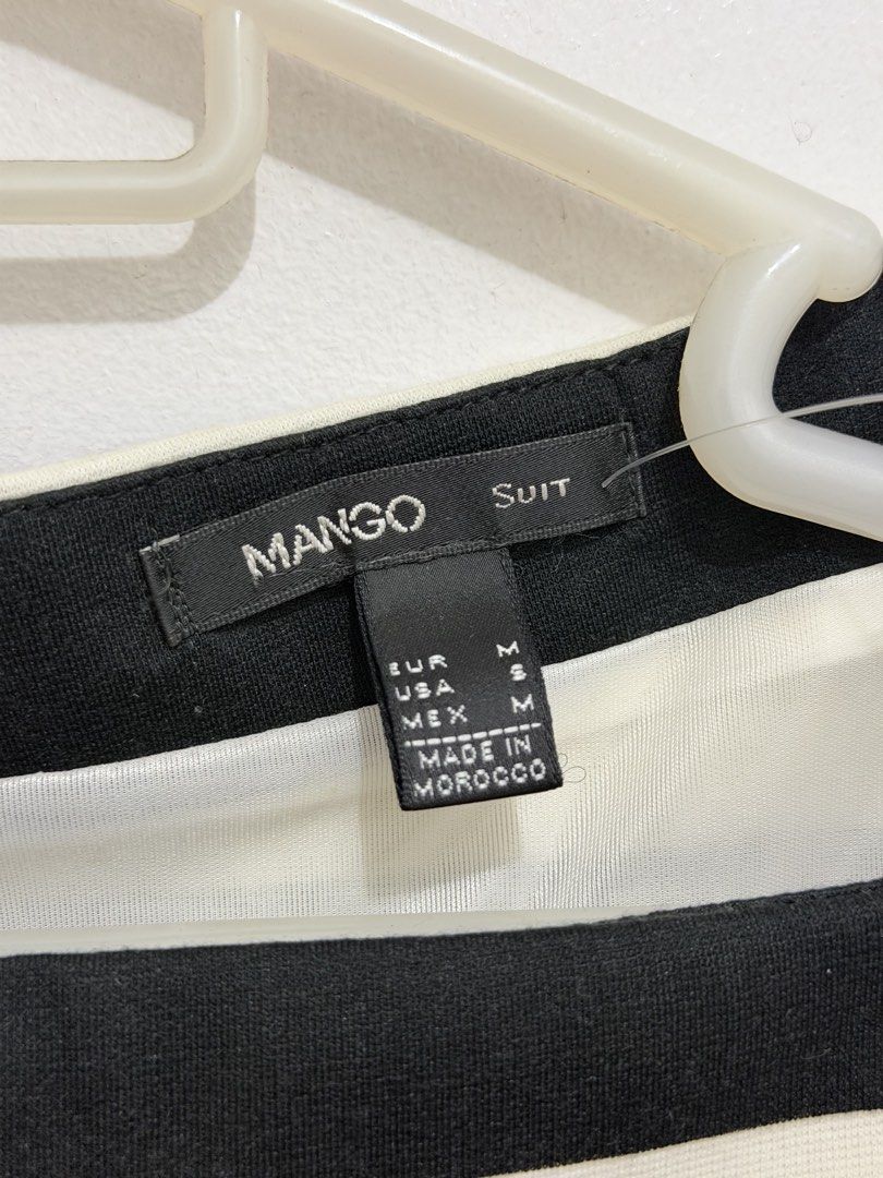 Mango Suit Black and White Striped Dress (Category: Dresses) located in Malolos. Submitted by eadiana (Listing ID 1468487330, Image 3). Description: - Brand: Mango Suit - Pattern: Black and white stripes with slimming solid black side panels - Cut: Sleeveless with a chic boat neckline - Details: Full-length exposed zipper down the back, fully lined interior - Size: M EUR/MEX (Equivalent to S USA) - Origin: Made in Morocco - Condition: Excellent, 