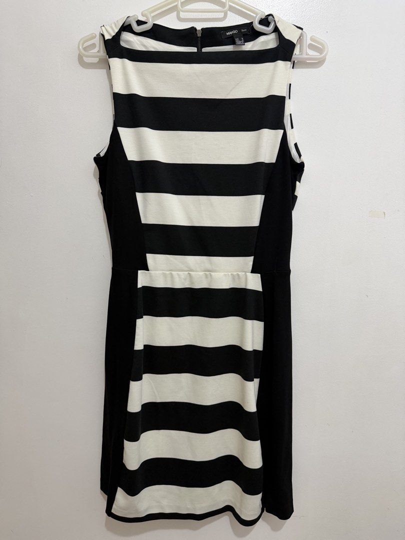 Mango Suit Black and White Striped Dress (Category: Dresses) located in Malolos. Submitted by eadiana (Listing ID 1468487330, Image 1). Description: - Brand: Mango Suit - Pattern: Black and white stripes with slimming solid black side panels - Cut: Sleeveless with a chic boat neckline - Details: Full-length exposed zipper down the back, fully lined interior - Size: M EUR/MEX (Equivalent to S USA) - Origin: Made in Morocco - Condition: Excellent, 