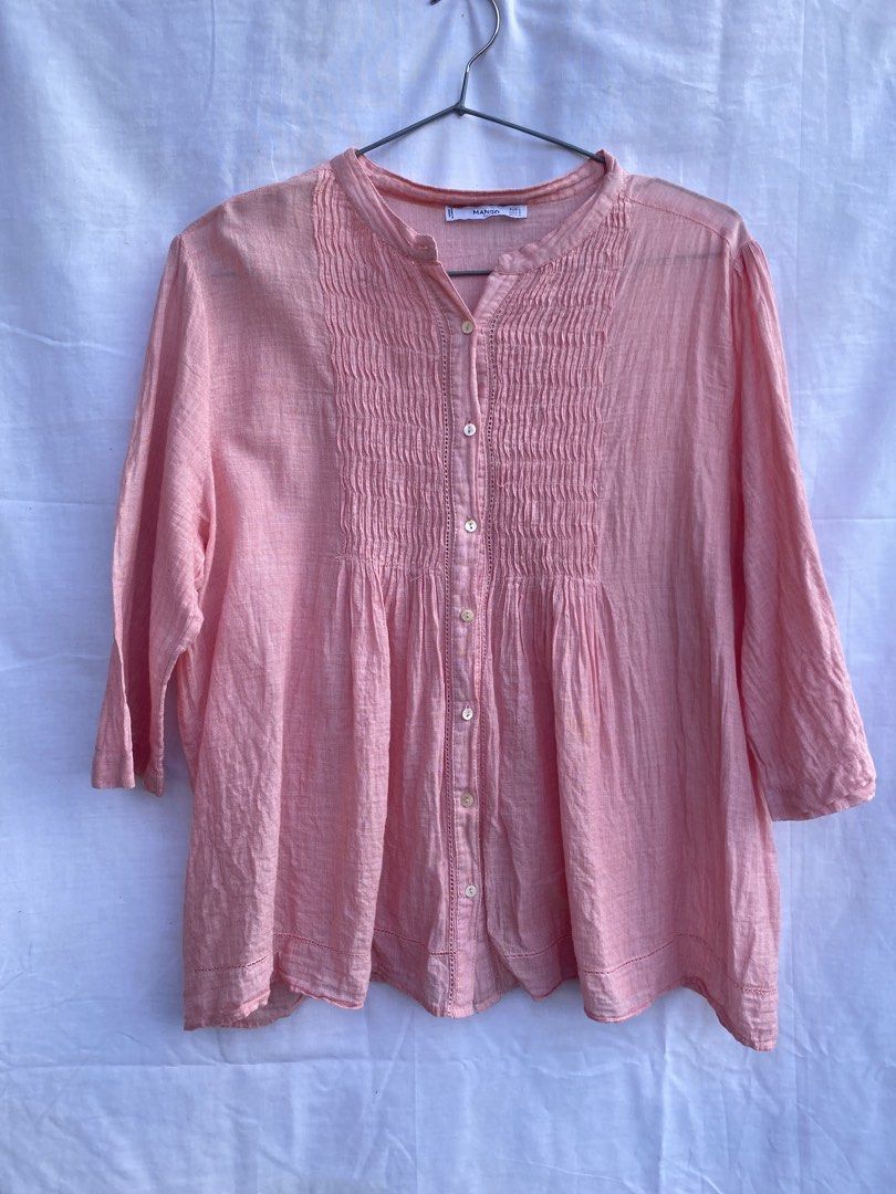 Mango Suit Pink Button-Up Blouse (Category: Blouses) located in Baguio. Submitted by royalriver17 (Listing ID 1468435822, Image 1). Description: - Brand: Mango Suit - Color: Pink - Size: EUR L / USA 8 / MEX G - Design: Button-up with smocked front detailing, mandarin collar, and long sleeves - Material: Textured lightweight fabric - Origin: Made in India - Styling: Versatile piece, easily pairs with denim or trousers.