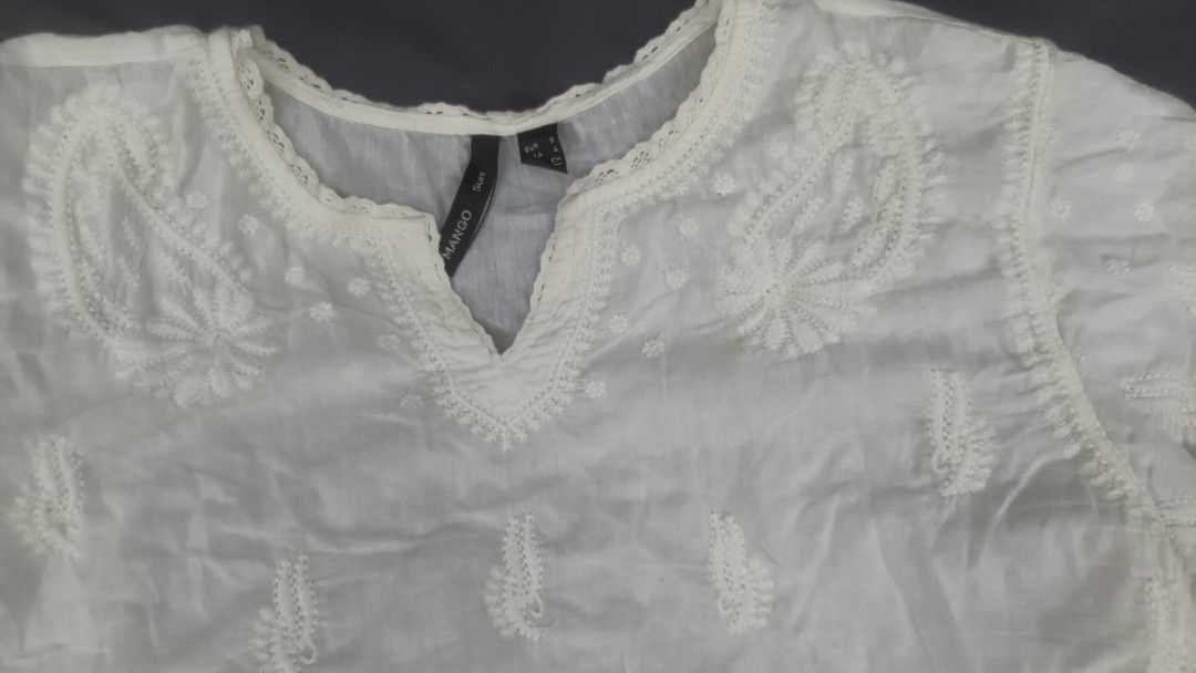 Mango White Embroidered Blouse (Category: Blouses) located in Mandaluyong City. Submitted by bestill4610 (Listing ID 1468406748, Image 3). Description: Mango white embroidered cotton top Pretty details Never used W 20" x L 24".