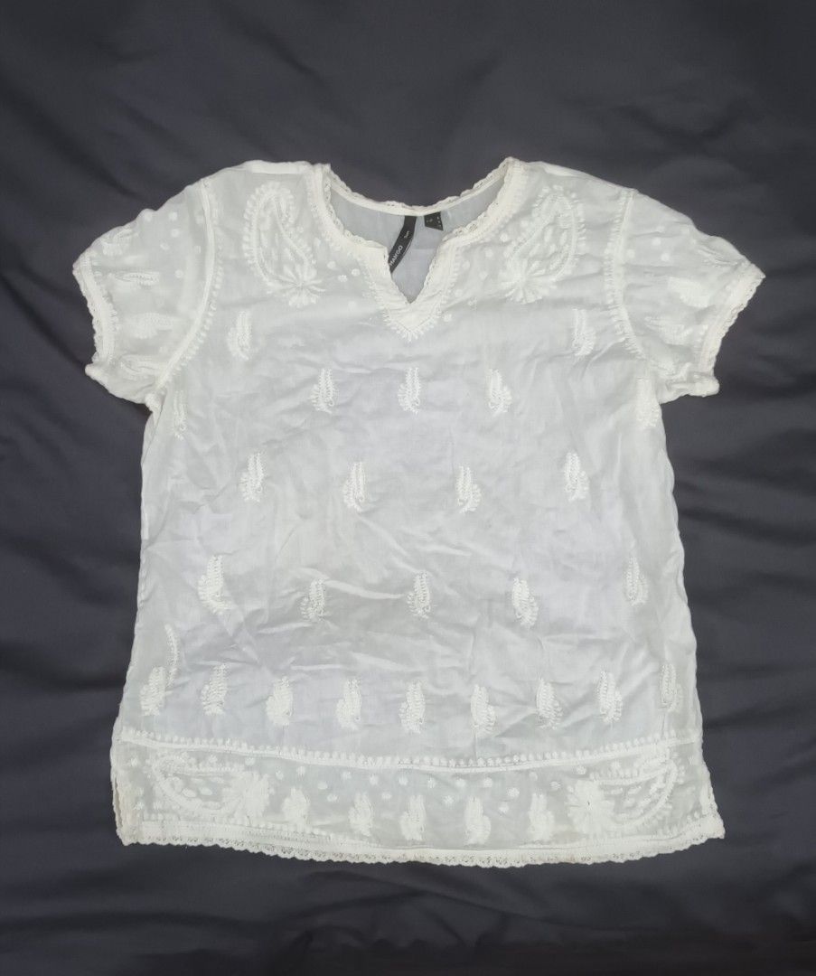 Mango White Embroidered Blouse (Category: Blouses) located in Mandaluyong City. Submitted by bestill4610 (Listing ID 1468406748, Image 2). Description: Mango white embroidered cotton top Pretty details Never used W 20" x L 24".