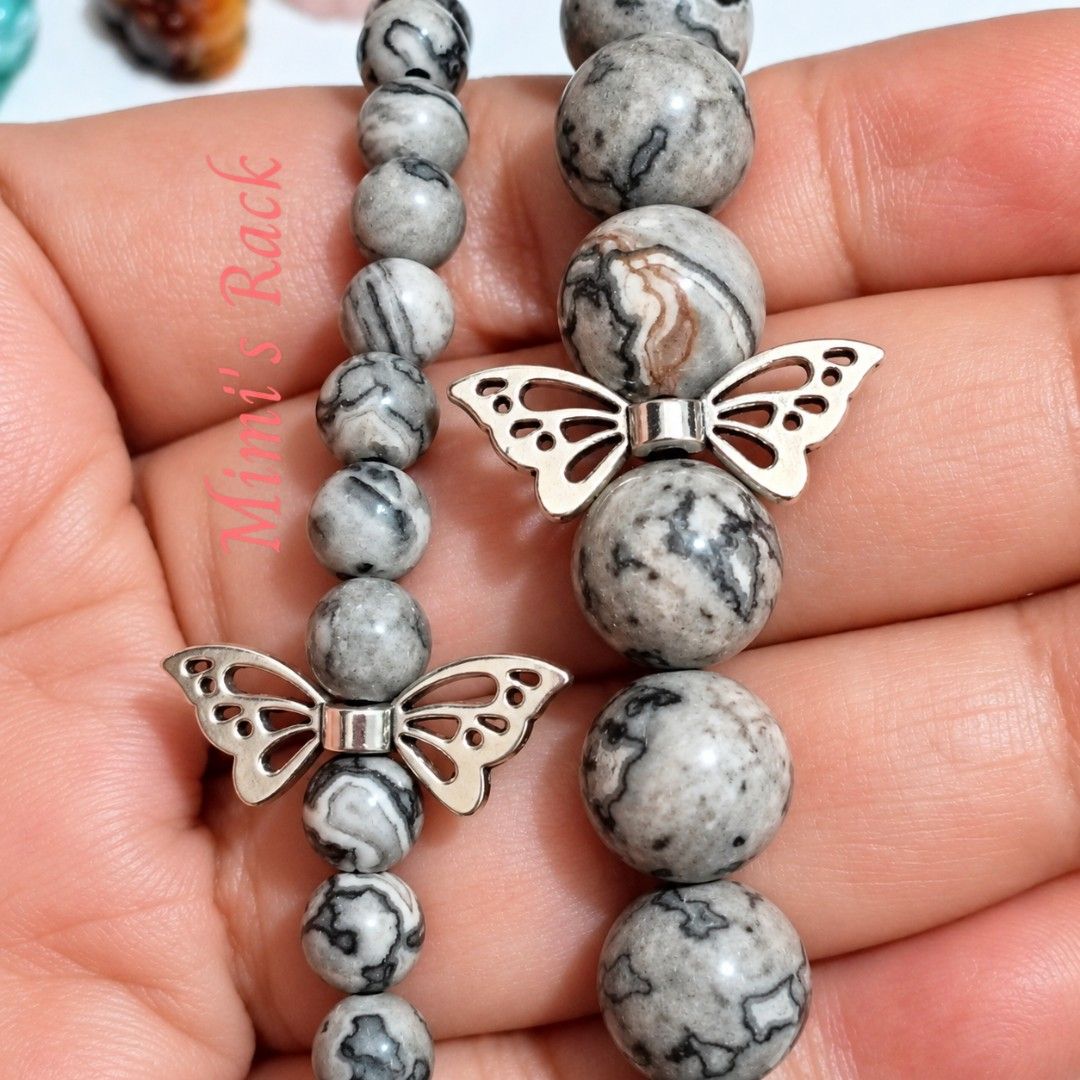 Map Jasper Stone Bracelet with Silver Butterfly Charm (Category: Bracelets) located in Taguig. Submitted by mimisrack (Listing ID 1468323291, Image 1). Description: 🩶A beautiful matching bracelet duo featuring map jasper beads in a unique mix of gray, black, and creamy white patterns. Each bead has its own distinctive markings, resembling miniature maps and natural landscapes. Finished with elegant silver-tone butterfly charms, these bracelets a