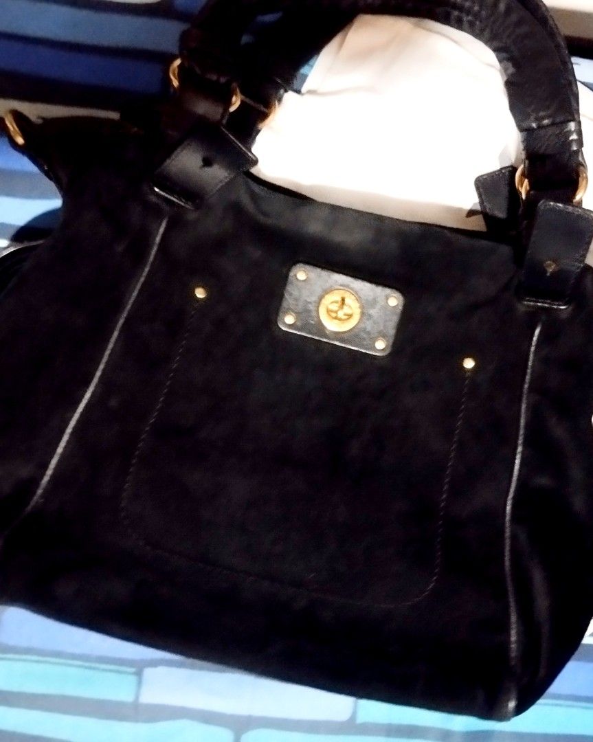 Marc by Marc Jacobs black suede handbag (Category: Cross-body Bags) located in Manila. Submitted by lene48 (Listing ID 1468296989, Image 1). Description: - Brand: Marc by Marc Jacobs - Material: Premium black suede - Hardware: Elegant gold-tone with front turn-lock pocket - Straps: Includes top handle and adjustable/removable leather shoulder strap - Interior: Soft suede finish main compartment - large size. - Condition: Well-maintained and ready