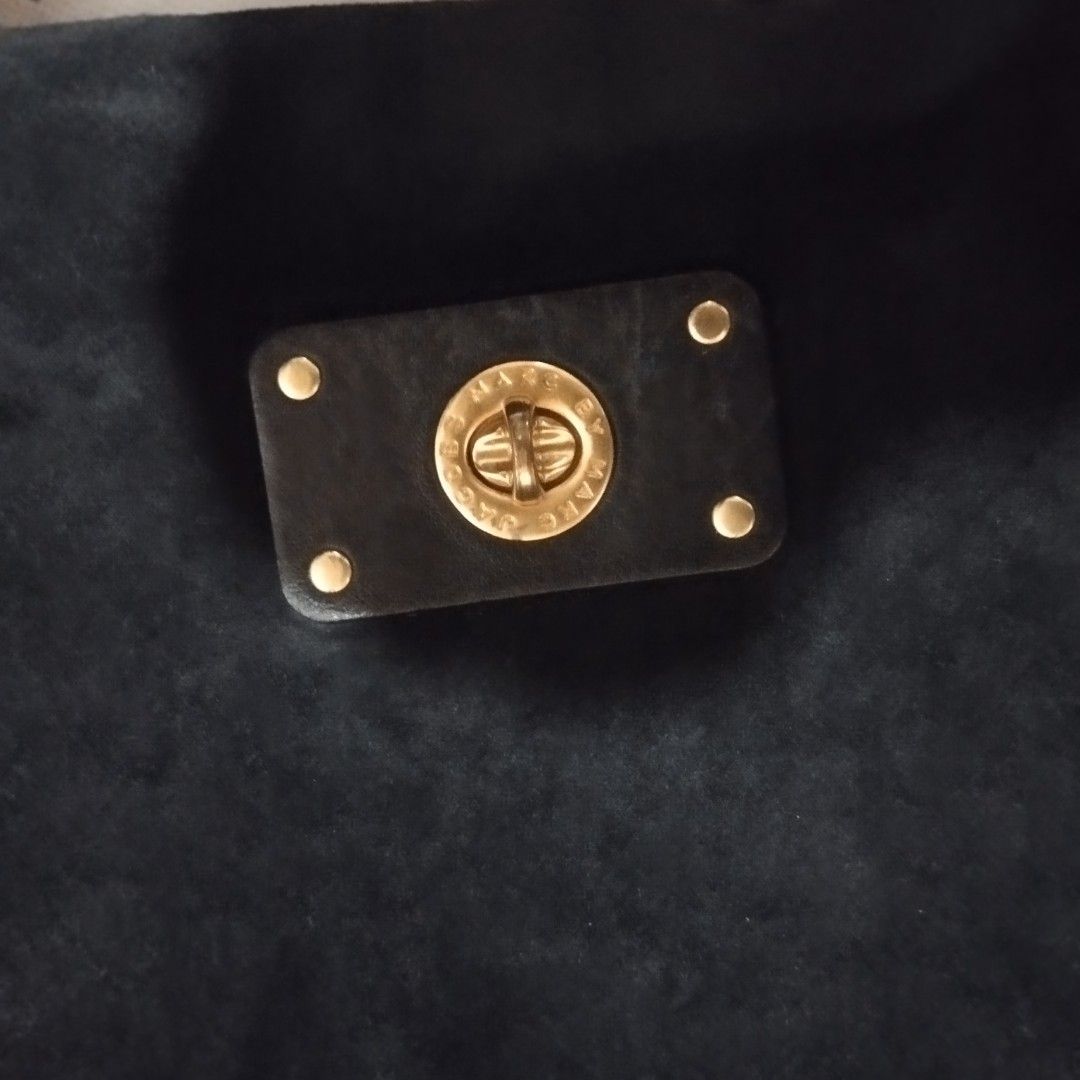 Marc by Marc Jacobs black suede handbag (Category: Cross-body Bags) located in Manila. Submitted by lene48 (Listing ID 1468296989, Image 3). Description: - Brand: Marc by Marc Jacobs - Material: Premium black suede - Hardware: Elegant gold-tone with front turn-lock pocket - Straps: Includes top handle and adjustable/removable leather shoulder strap - Interior: Soft suede finish main compartment - large size. - Condition: Well-maintained and ready