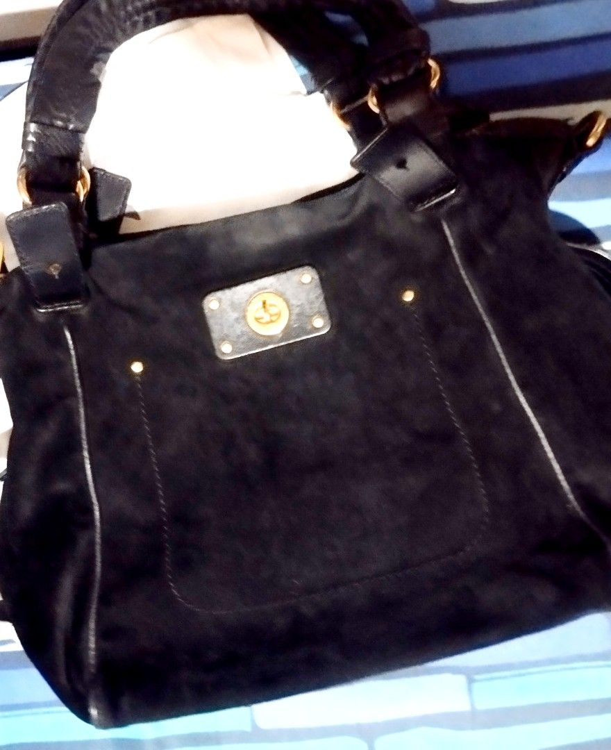 Marc by Marc Jacobs black suede shoulder bag (Category: Cross-body Bags) located in Manila. Submitted by lene48 (Listing ID 1468498636, Image 1). Description: - Brand: Marc by Marc Jacobs - Material: Soft black suede with leather trim and contrast stitching - Hardware: Gold-tone turn-lock front pocket and engraved zippers - Straps: Double leather shoulder straps with ring attachments - Interior: Spacious main compartment for your daily essentials