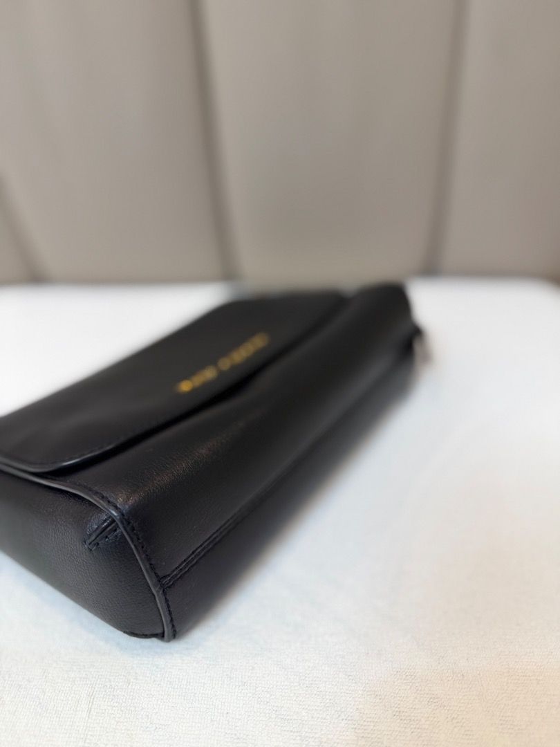 Marc Jacobs Black Leather Crossbody Bag (Category: Cross-body Bags) located in Rizal. Submitted by je_resada (Listing ID 1468434307, Image 3). Description: - Authentic Marc Jacobs crossbody bag - Crafted from durable black textured leather - Elegant gold foil logo on the front flap - Secure magnetic closure - Slim shoulder strap with polished gold-tone hardware - Structured, compact size ideal for daily essentials - Versatile minimalist design ma