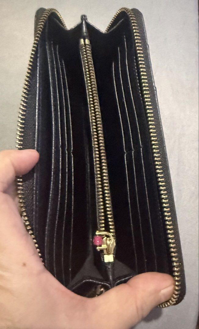 Marc Jacobs Zip Around Wallet Pink Purple (Category: Wallets & Card holders) located in Cainta. Submitted by mykee1 (Listing ID 1468372377, Image 2). Description: - Brand: Marc Jacobs - Style: Long zip-around wallet - Color: Pink and purple block design - Material: Textured Saffiano leather - Hardware: Gold-tone metal with branded zipper pull - Details: Stamped front logo - Interior: Multiple card slots and compartments for daily organization.