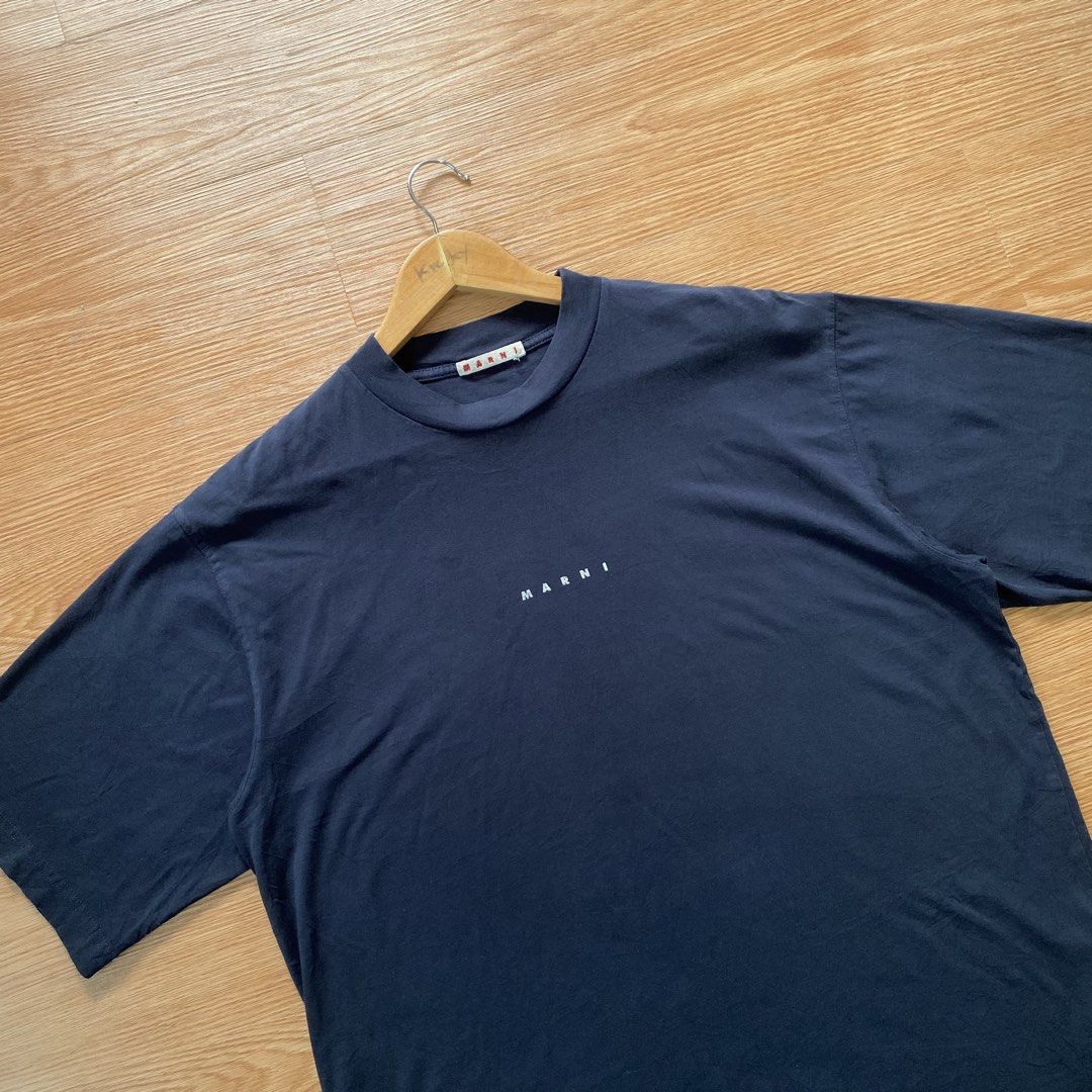 Marni t-shirt navy blue (Category: Formal Shirts) located in Bislig. Submitted by kre_jey.24 (Listing ID 1468342916, Image 2). Description: Dimes 22x27 large Good as new No issue.
