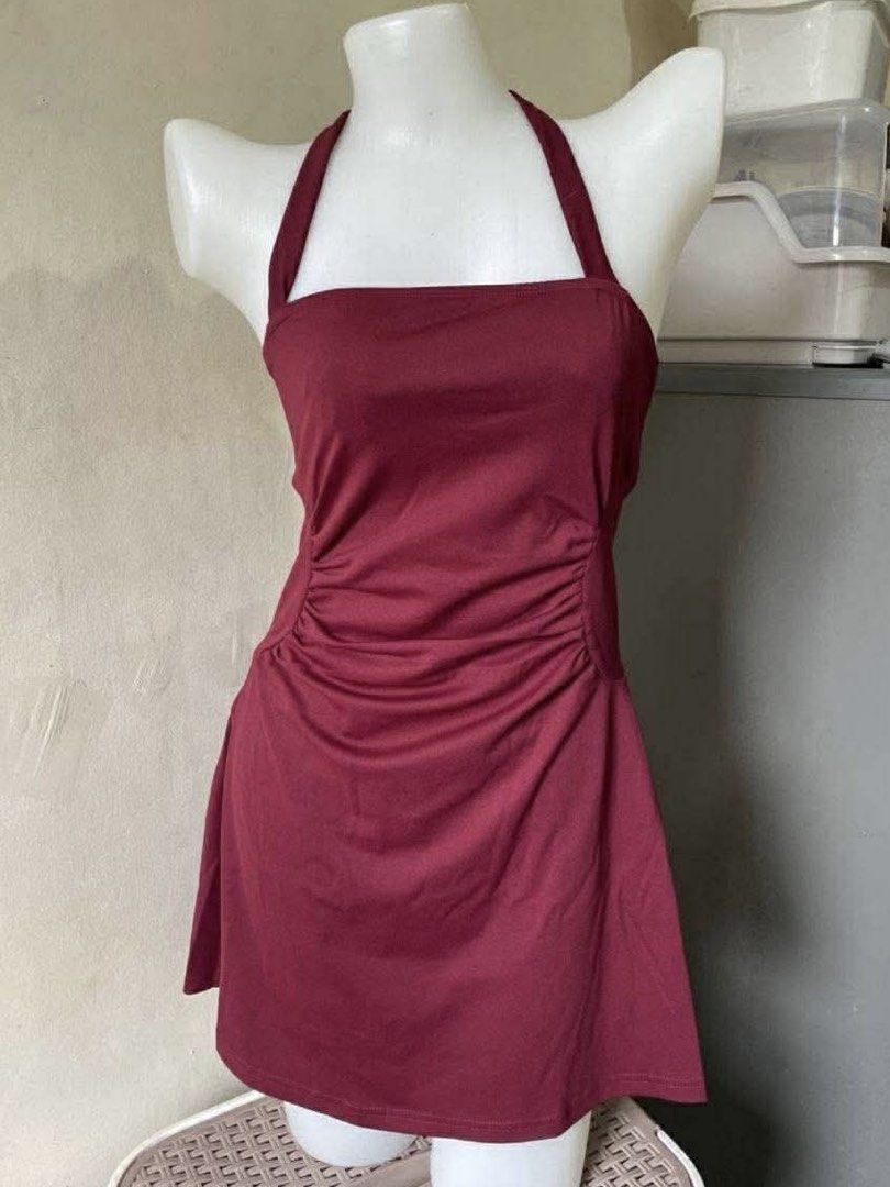 Maroon Halter Neck Dress with Ruched Sides (Category: Dresses) located in Manila. Submitted by lucipurrpreloved (Listing ID 1468341045, Image 1). Description: - Color: Maroon - Style: Halter mini dress with adjustable tie-back - Fit: Flattering ruched side panels with soft, stretchy fabric - Condition: Worn once, still in great shape.