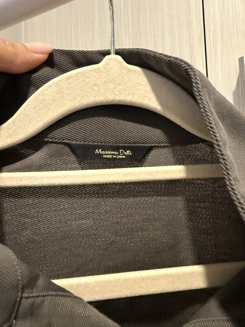 Massimo Dutti Grey Polo Shirt Size S (Category: Tshirts & Polo Shirts ) located in Cebu City. Submitted by onlineclosetbypat (Listing ID 1468286471, Image 2). Description: - Brand: Massimo Dutti - Color: Grey - Size: Small (EUR, USA, MEX) - Material: Ribbed knit texture - Details: Classic collar, button placket, small branded metal plaque near hem.