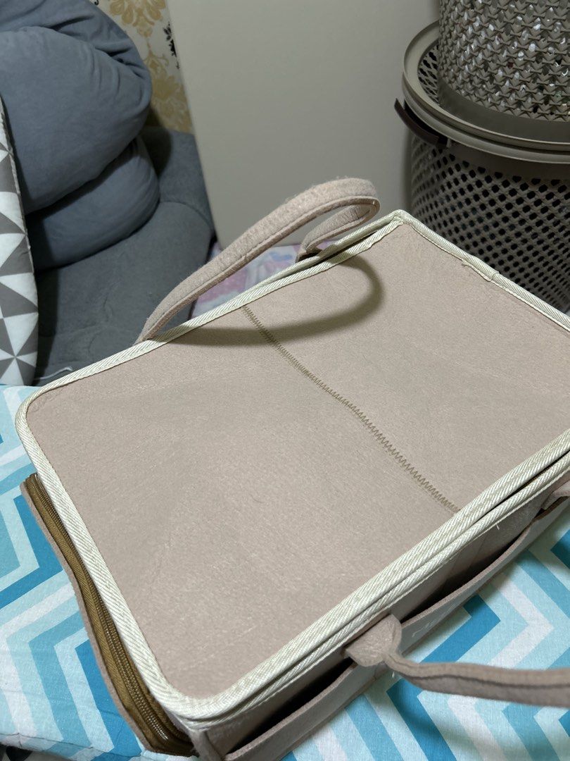 Matmat + Luju Felt Storage Caddy Organizer (Category: Storage Boxes & Baskets) located in Batangas. Submitted by chubyyyyy (Listing ID 1468385536, Image 3). Description: - Brand: Matmat + Luju - Color: Beige - Material: Sturdy felt with smooth interior lining - Features: Zipped top lid, sturdy carry handles, multiple exterior front pockets, and removable interior dividers for customizable compartments - Condition: Clean inside and out, excellent 