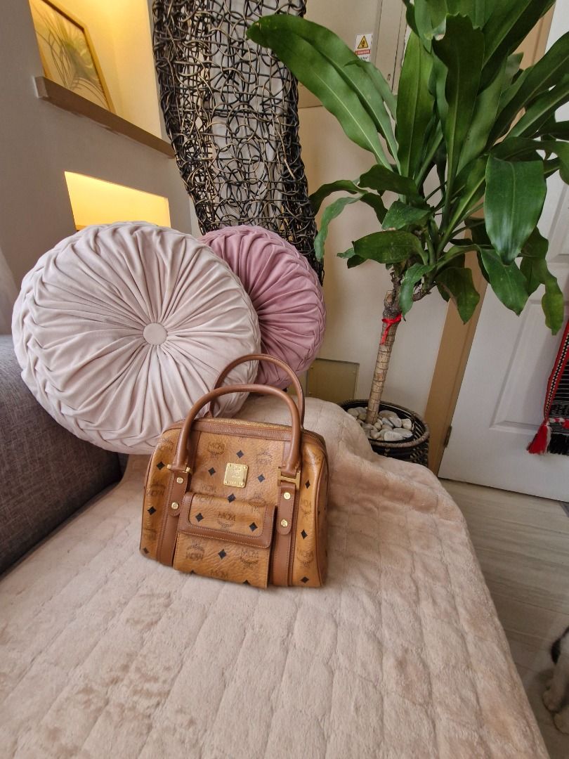 MCM Visetos Monogram Boston Handbag Brown (Category: Luxury Bags & Wallets) located in Angeles City. Submitted by mycloset525clotheshoppe (Listing ID 1468290464, Image 1). Description: - Authentic MCM Boston bag in signature brown monogram coated canvas - Classic gold-tone hardware with sturdy double top handles - Convenient front flap pocket with a secure snap closure - Structured everyday size that holds daily essentials - Clean interior lining