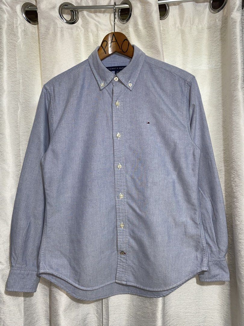 Men's Tommy Hilfiger Oxford Button Down long Sleeve (Category: Formal Shirts) located in Davao. Submitted by VapenDrip (Listing ID 1468359163, Image 1). Description: Men's Tommy Hilfiger Oxford Button Down long Sleeve Small custom fit on tag L-26.5/27.5 W-19.5 Excellet to new condition Authethic 750+sf.